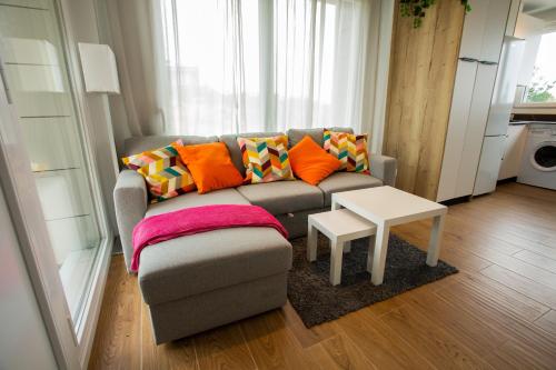 a living room with a couch and a table at Sopela Kosta Fun in Sopelana