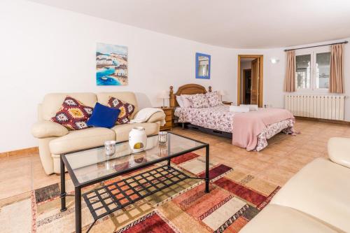 a living room with a couch and a table at Apt B Algemesi Moraira in Moraira