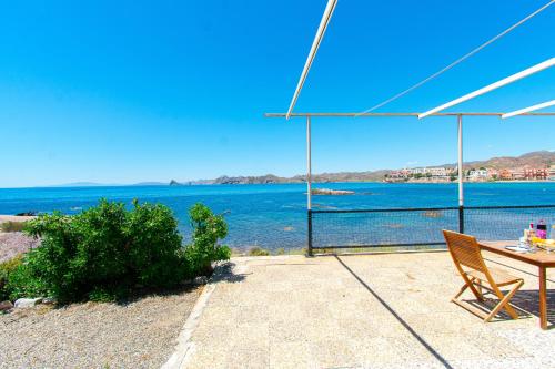 a patio with a table and a view of the water at Terraza del Mediterráneo - By Aloha Palma in Calabardina