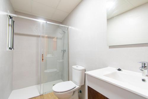 a bathroom with a shower and a toilet and a sink at Terraza del Mediterráneo - By Aloha Palma in Calabardina