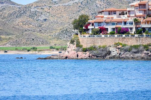 a group of houses on the shore of a body of water at Terraza del Mediterráneo - By Aloha Palma in Calabardina