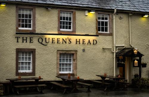 a sign that reads the queens head on the side of a building at Queen's Head Askham in Penrith