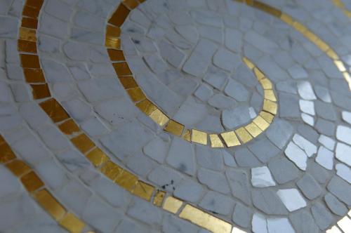 a mosaic floor with a moon on it at Rocco Forte Hotel De Russie in Rome