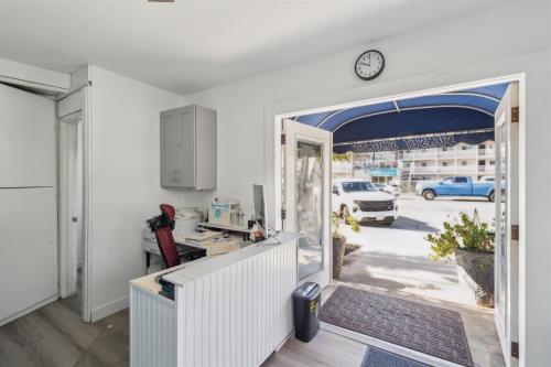 an office with a door open to a yard at 1 Bed Beach Condo #131 in Carpinteria