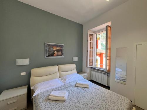 Ένα ή περισσότερα κρεβάτια σε δωμάτιο στο La Casa del Pinguino - In the Center with AC