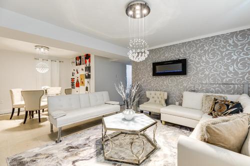 a living room with a couch and a table at Walk to Beach Elegant Escape in Lusby! in Lusby