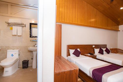 Voodi või voodid majutusasutuse Busy Bee Resort, Pokhara toas
