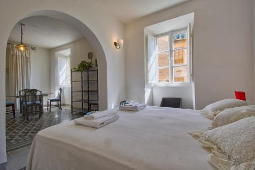 Ένα ή περισσότερα κρεβάτια σε δωμάτιο στο Palazzetto d'epoca