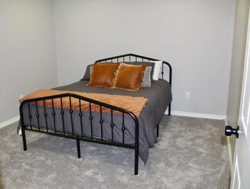 a bed with two pillows on it in a room at Limestone Hideaway in Jewett