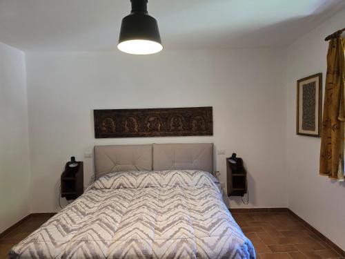 Postel nebo postele na pokoji v ubytování Cà di Mencio