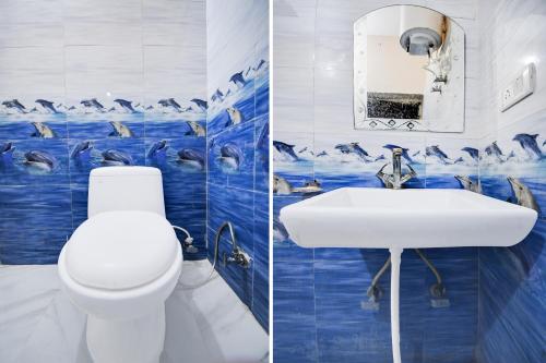 two pictures of a bathroom with blue and white tiles at Super Hotel O Brij Inn and Banquets in Lucknow