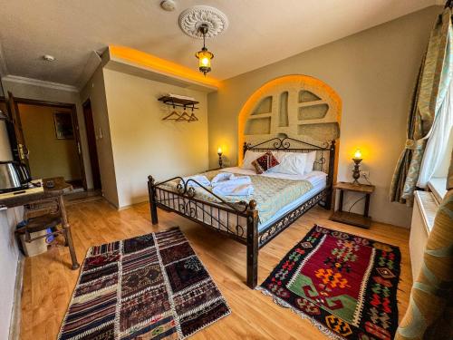 Ένα ή περισσότερα κρεβάτια σε δωμάτιο στο Nomads Cave Hotel & Rooftop