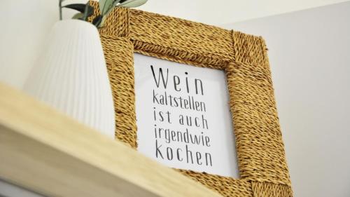 a picture frame with the words worm kittittification just another inappropriate kitchen at Nordseekrabbe F1 in Butjadingen OT Tossens