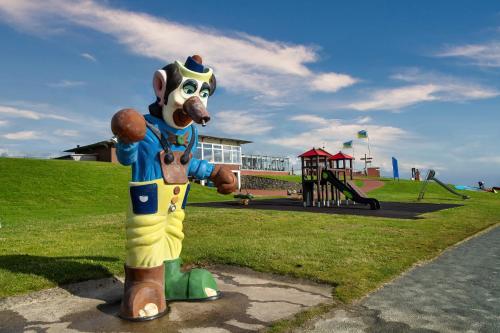 a statue of a mascot standing in a park at Nordseekrabbe F1 in Butjadingen OT Tossens