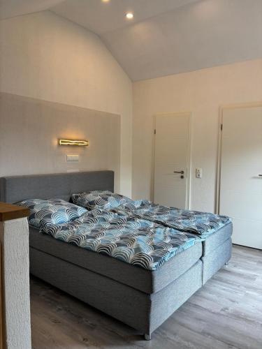 a bedroom with a large bed in a room at Wohlfühloase in Quiddelbach in Quiddelbach