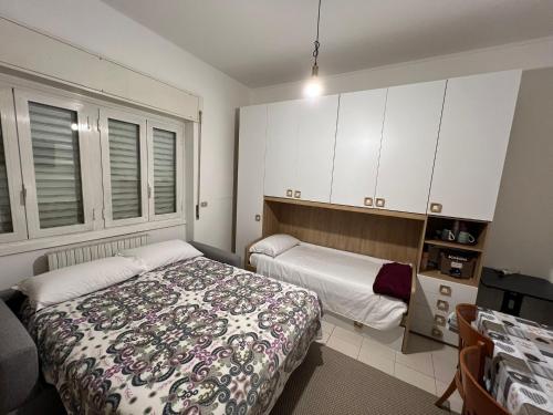 A bed or beds in a room at Hotel Fioralba