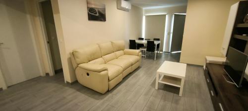 a living room with a couch and a table at Rocha Apartment Plus in Portimão