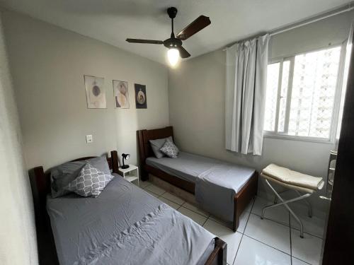 Katil atau katil-katil dalam bilik di STropez com vista pro mar - Praia Areia Preta