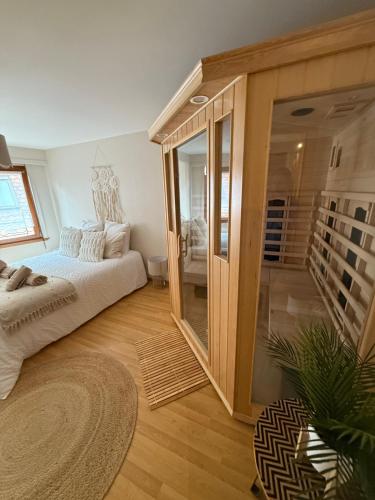 a bedroom with a bed and a staircase in it at Le Nid Zen Obernois - 4 guests in Obernai