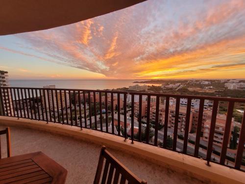 a view of the ocean from a balcony at sunset at O WOW View Portimao, ALvor, ALGARVE in Portimão