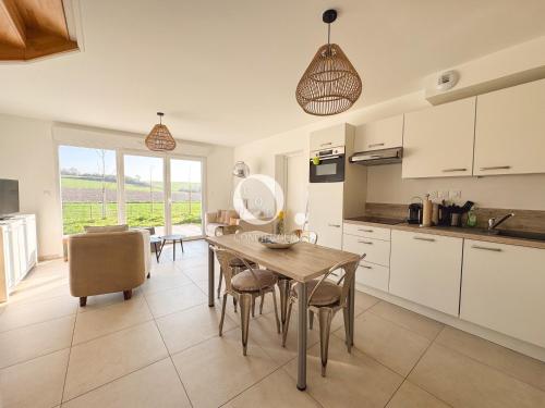 a kitchen and dining room with a table and chairs at COC - Idem in Wissant