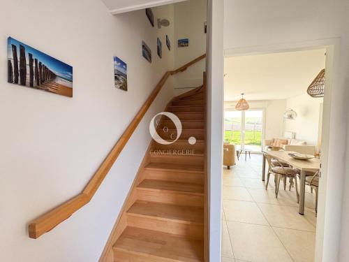 a staircase leading up to a living room and dining room at COC - Idem in Wissant