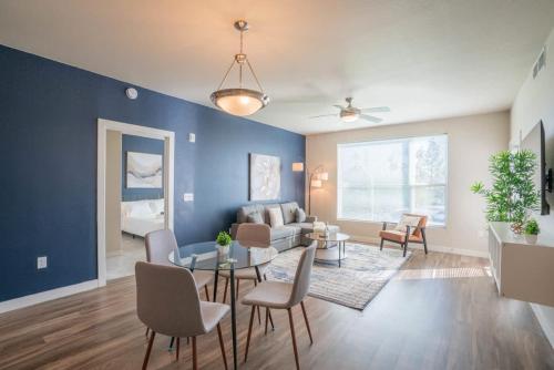 a living room with a couch and a table at Posh 2BD - Gym, Pool, Parking, W-D - Sleeps 8 in Tempe