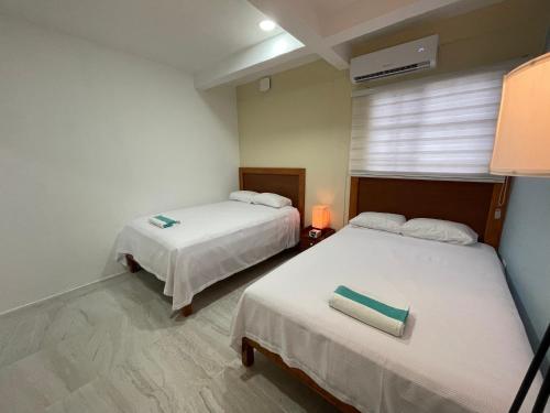 Una cama o camas en una habitación de Casona Suites