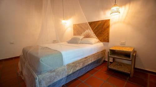 Ένα ή περισσότερα κρεβάτια σε δωμάτιο στο M HOSTEL Tayrona