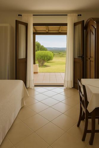 Ένα ή περισσότερα κρεβάτια σε δωμάτιο στο Agriturismo Nuraghe Tuttusoni