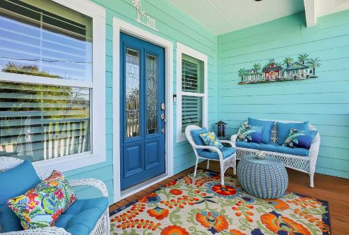 a blue front porch with chairs and a blue door at Kemah Baydreaming Near Kemah Boardwalk in Kemah