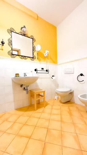 a bathroom with a sink and a toilet at Suite Casa Santicelli Maratea in Maratea