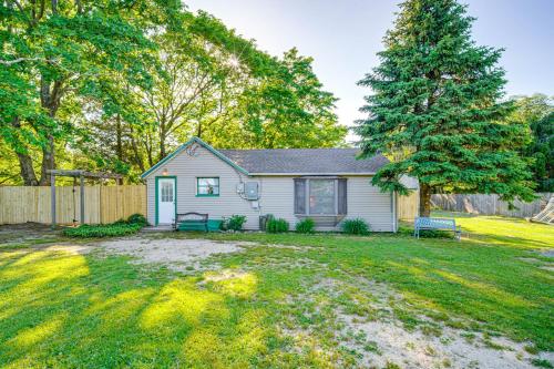 a white house with a fence and a yard at Pet-Friendly Little Egg Harbor Home with Fenced Yard in Little Egg Harbor Township