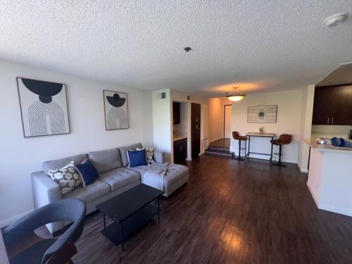 a living room with a couch and a table at Hollywood Awesome Stay Free parking in Los Angeles