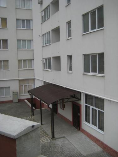 a large building with a table in front of it at Ciocana apartment in Chişinău