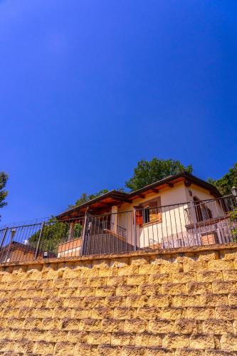 a house on top of a brick wall at Bed & Breakfast Duchessa - 2 Private Rooms with Ensuite Bathrooms in Lapedona