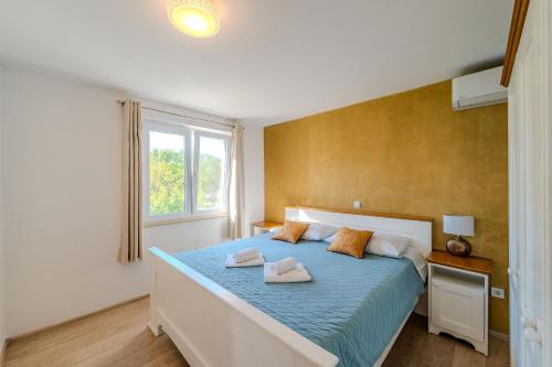 Posteľ alebo postele v izbe v ubytovaní Apartments Batela