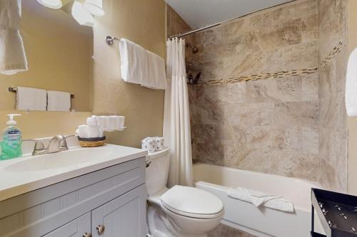 a bathroom with a toilet and a sink and a shower at 11529 Snowpeak Way #619 in Truckee