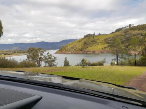 a view of a lake from a car window at Coves Cottage in Piries