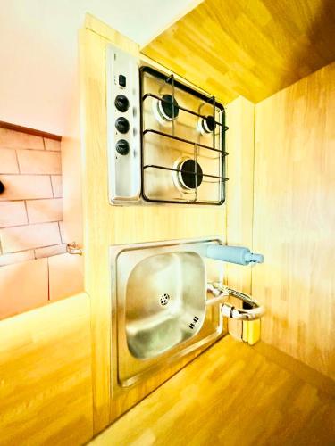 a small bathroom with a sink and a toilet at Campo Smith - Les Floralies free parking in Bardonecchia