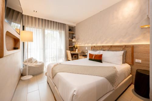 a bedroom with a large bed in a room at Landmark Hotel in Medellín