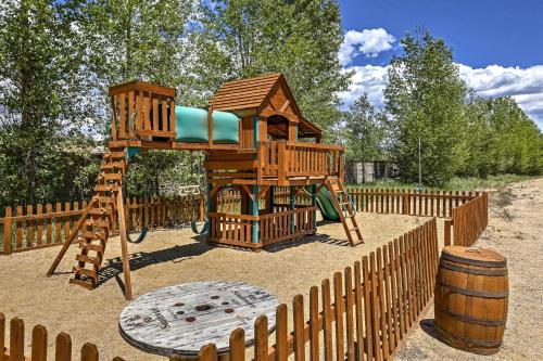a wooden playground with a tree house and a barrel at 4 Mi to Granby Ranch Home with Mtn Views in Granby