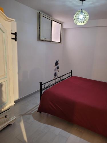 Ένα ή περισσότερα κρεβάτια σε δωμάτιο στο Casa Narciso Villasimius