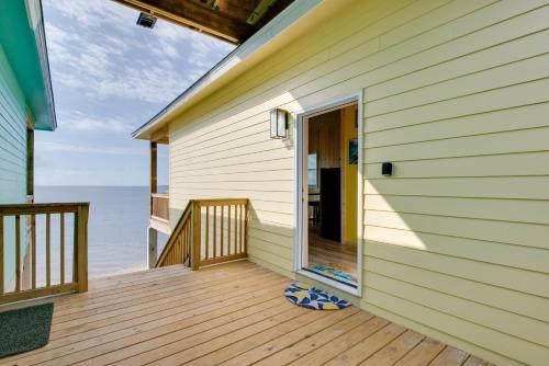an open door on a house with a deck at Florida Gulf Coast Getaway with Dock and Beach Views in Lanark Village