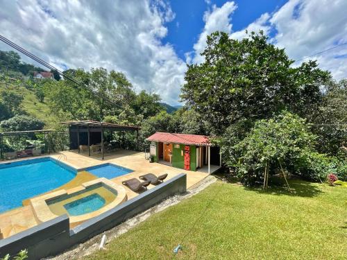 a house with a swimming pool in a yard at Eco Boutique House in La Vega