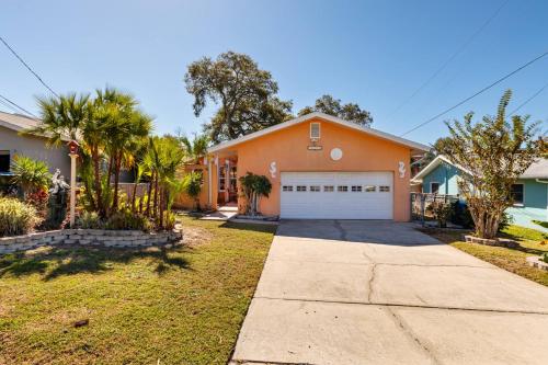 a orange house with a white garage at Pineapple Republic in Anona