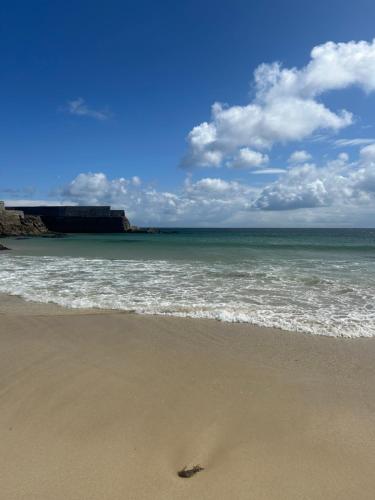 a footprint in the sand on the beach at Taigh Plo in Lionel