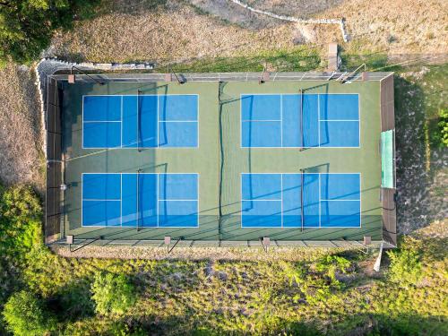an overhead view of a building with blue windows at Romantic Lake Retreat - Deck, BBQ Grill & Patio in Spicewood