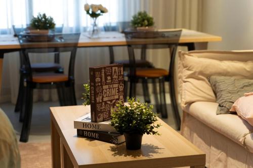a living room with a couch and a table at Apartment in Alkhoud Muscat in Maţār as Sīb ad Duwalī