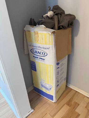 a cardboard box sitting on the floor in a room at Ground-level bed bath house1mi to the beach sleep8 in Long Branch
